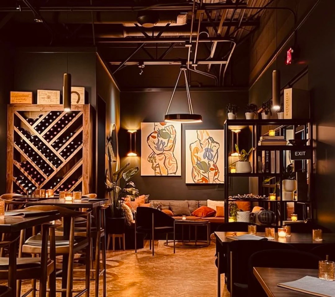 Lola Wine Lounge interior with warm lighting and art